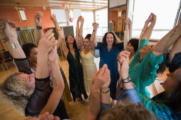 Women rising in song with Julie Blue